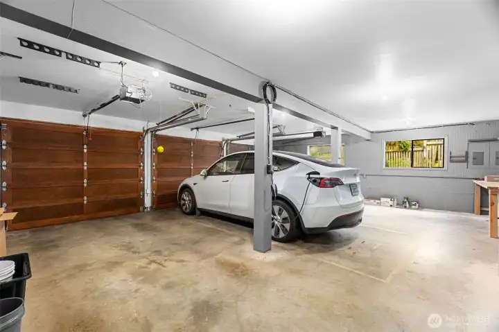 EV car charging station in this oversized three car garage.