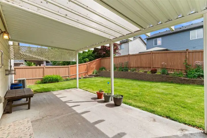 Fully fenced back yard and covered patio. Tasteful perimeter landscaping saves room for play. Fully fenced back yard and covered patio. Tasteful perimeter landscaping saves room for play.