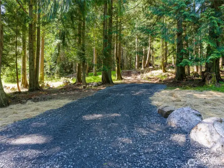 Driveway recently completed is partially to the building site.