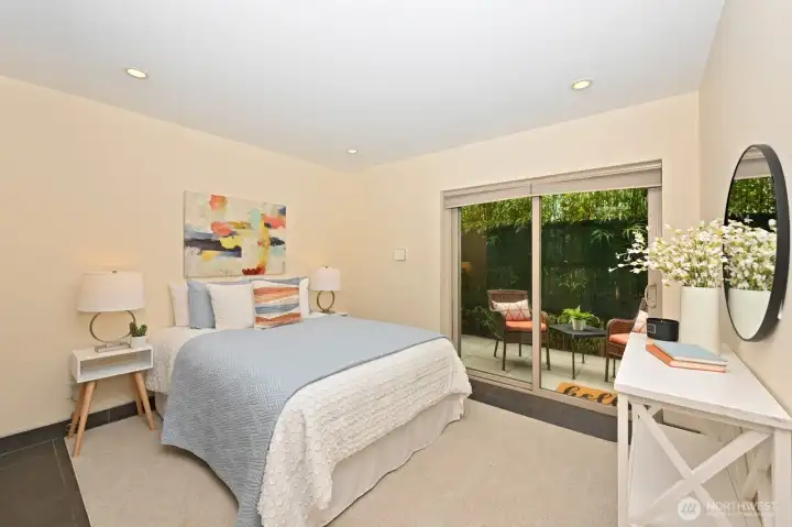 Bedroom 2 with walk-in closet, en-suite bath, heated tile floors & private patio. Bedroom 2 with walk-in closet, en-suite bath, heated tile floors & private patio.