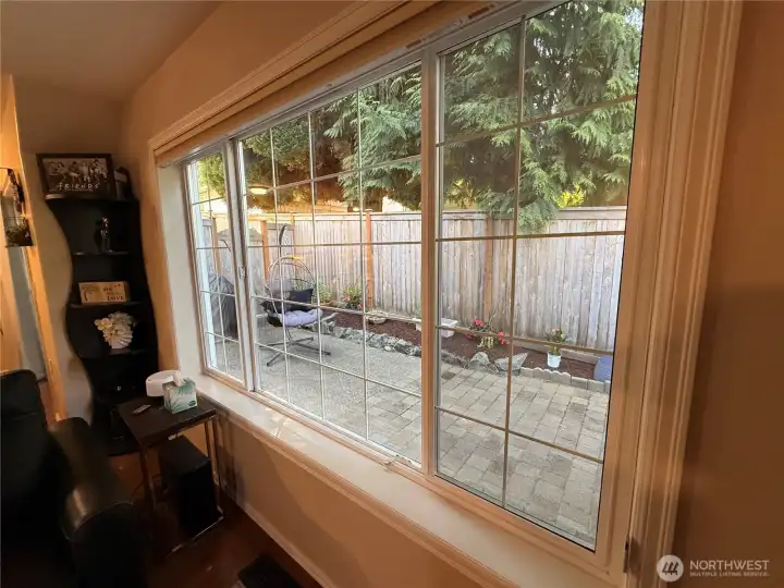 Window from Living room to a private fenced patio - adds privacy