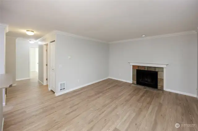 Living room with wood burning fireplace.