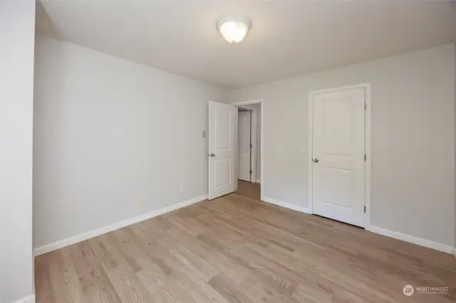 Primary suite with small walk in closet and 3/4 bath.