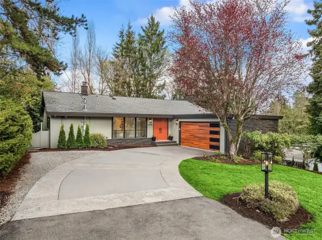 Private drive leads to a beautifully designed two car garage with ample storage space- perfect for storing bikes, kayaks, and more!