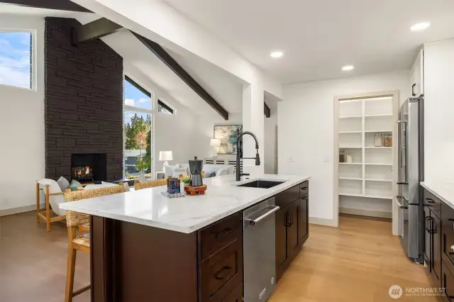 This kitchen was entirely reconfigured and now opens into the heart of the home and boasts a layout that invites gathering.