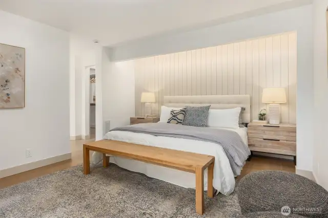 The main level now includes a newly created primary suite, boasting a designer accent wall.