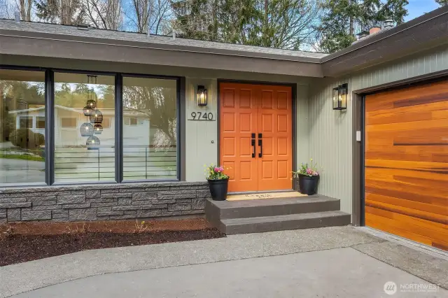 From the moment you arrive, you’re greeted by a bold terracotta-hued front door—a striking, sun-warmed statement that hints at the curated beauty within.