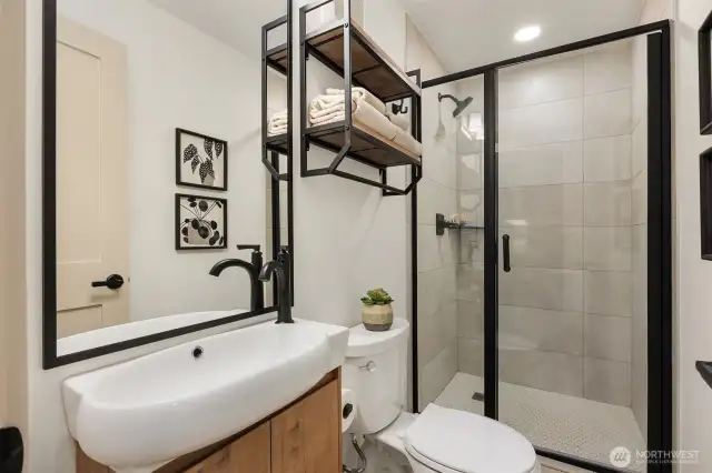 Beautiful downstairs 3/4 bath with large shower and beautiful finishes.