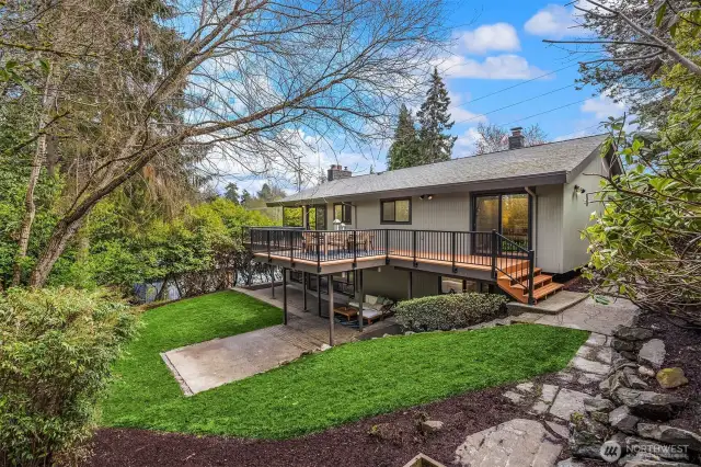 Entertainment deck with private steps down to a lush green yard- An entertainers dream!