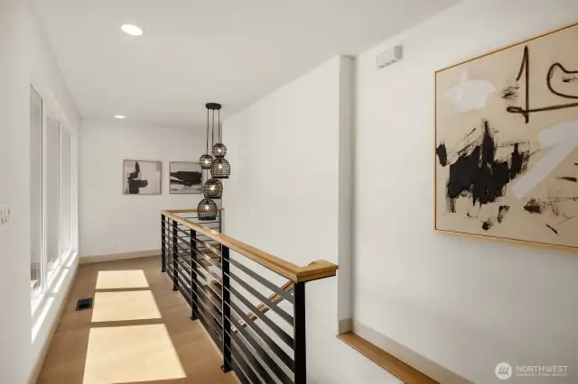 Playful woven light fixtures dance above the staircase with an effortless, elevated charm.