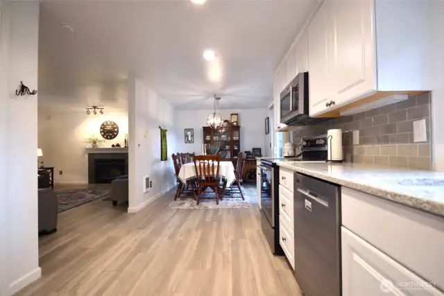Kitchen looking into the dinning room. Never miss a beat as you can cook and still mingle with family or guest.