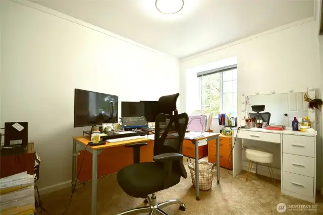 All the bedrooms are spacious this first room is being used as an office.