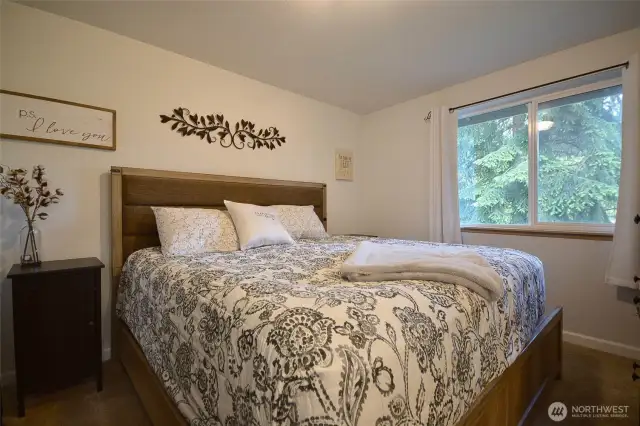Primary bedroom has a king size bed and there is still plenty of room    with walk-in closet.