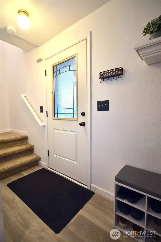 Entry way, this home has so much to offer new floors LVP, newer carpet, interior paint, new kitchen cabinets , quarts counter tops, pull outs in cabinets, newer appliances. Too many to list.