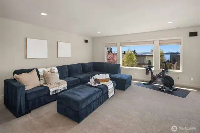 A flexible bonus room with built-ins and a wet bar invites creativity as a media lounge, office or play space.