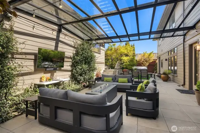 The backyard is a true rarity in West of Market: enjoy a covered, light-filled outdoor space for all-season entertaining, a beautiful turf yard, a relaxing hot tub and an exceptionally rare 4-car garage.
