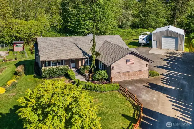 Beautiful Rambler with a Huge Shop – All on 1.5 Private Acres!