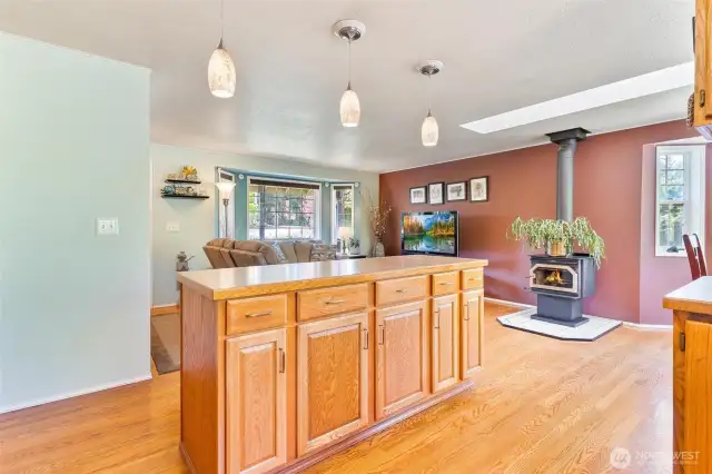Warmth & Function – Kitchen Island Meets Cozy Wood Stove Comfort