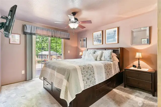 Primary bedroom with private access to backyard deck