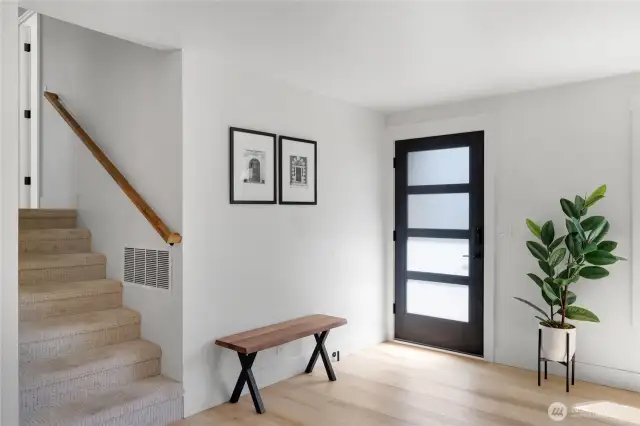 Entry way from front door with stairs to the bedrooms shown on left.