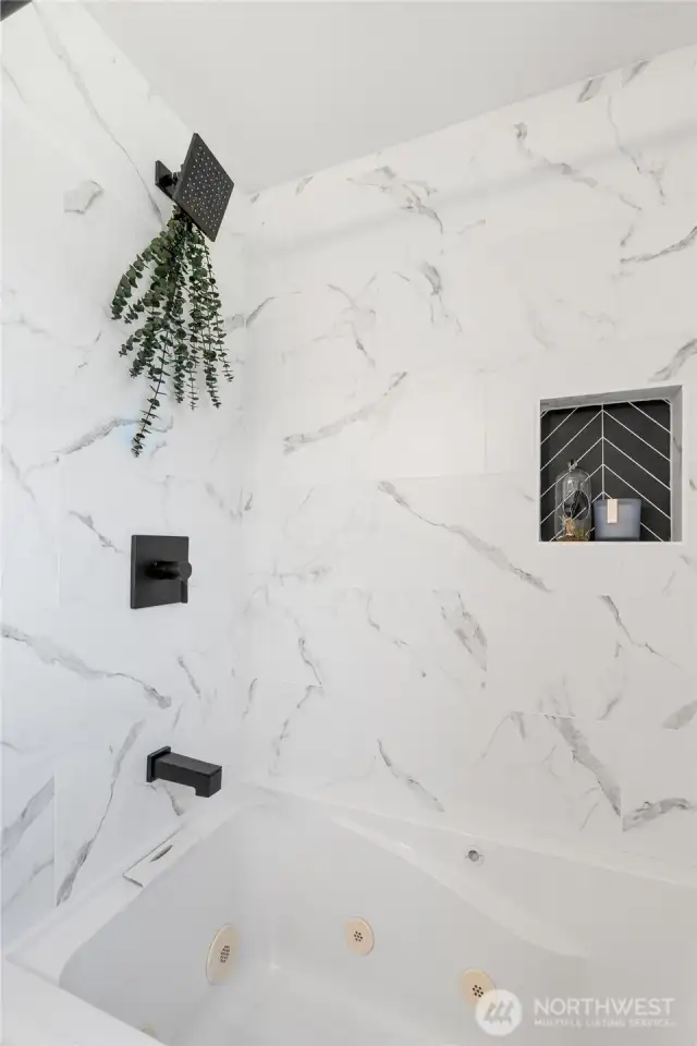Newly tiled shower/tub enclosure in main bath.