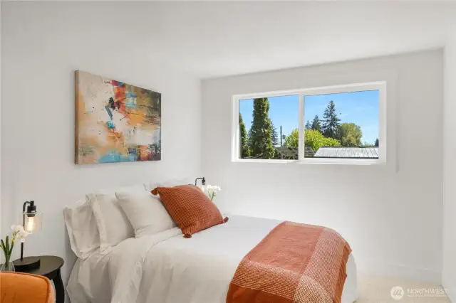 Bedroom 2 features a large closet and a bright, front-facing window with excellent morning light.