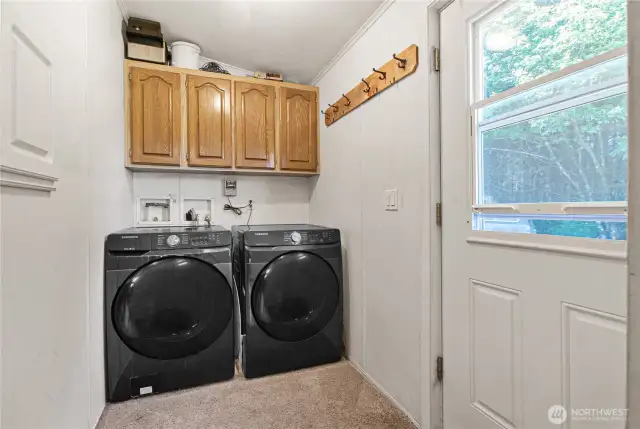 The laundry area offers built-in storage for added convenience, and all appliances are included—making move-in a breeze.