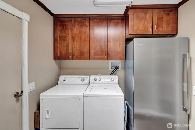 Laundry room with freezer and plenty of cabinets