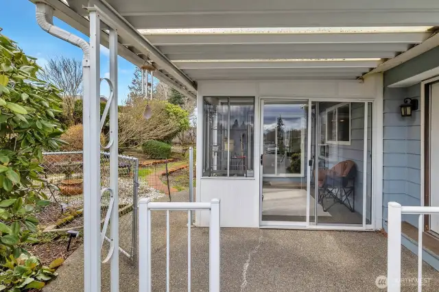 Great sunroom is adjacent to the side yard
