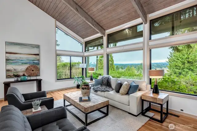 Expansive hardwood floors flow seamlessly throughout, grounding the space in timeless elegance
