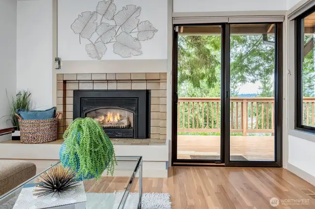 Large sliding glass doors lead out to a deck, offering a beautiful spot to enjoy morning coffee or simply take in the serene mountain views.