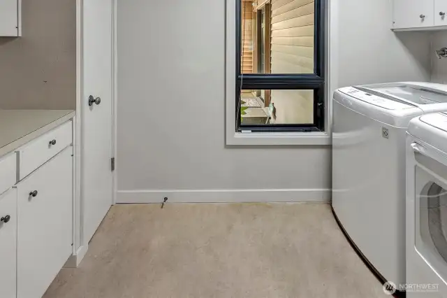 The large utility room serves as a walk-in pantry for extra storate.