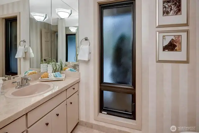 A powder room nearby adds convenience for guests.