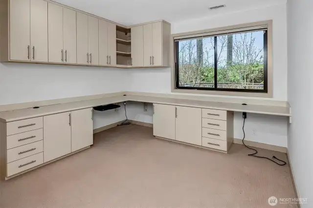 For those who work from home or need a designated study space, a custom-designed office by California Closets provides an exceptional workspace. Built-in cabinets and shelving ensure organization.