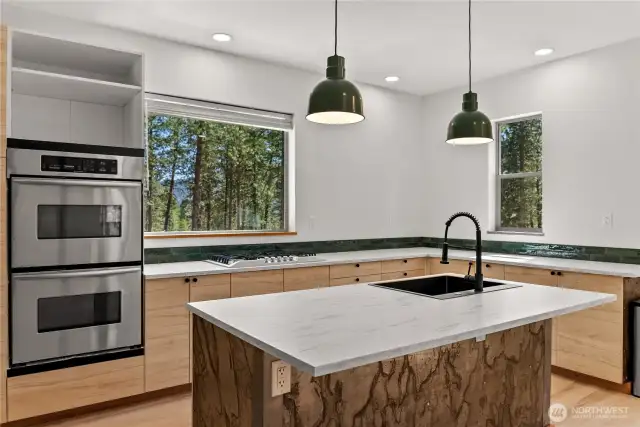 Double ovens and large surface area on center island.