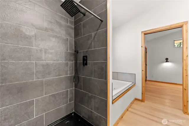Walk in tiled shower off of primary bedroom.