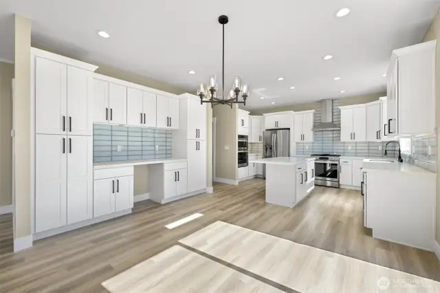 The kitchen and dining area.  The built in bar has a space for a small fridge or wine cooler.