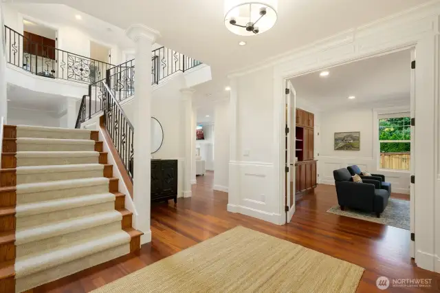 Formal entry leads to an open staircase. Having this staircase, landing, and 2-story opening to a skylight allows for consistent natural light - even on the darkest of days.