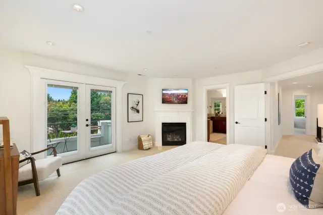 Primary is complete with a private balcony, gas fireplace, 5pc bath, and walk-in-closet.