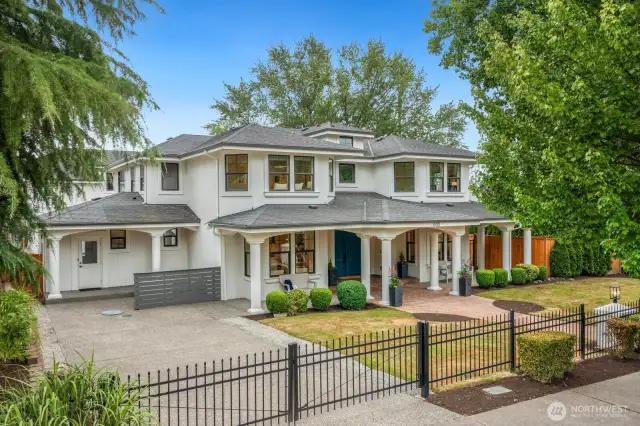 There is never a shortage of parking. Three garages out back and this huge gated driveway. The Hummingbird gates are beautiful!