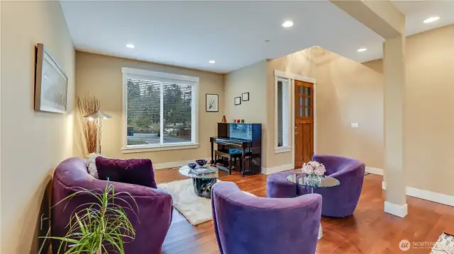 Open & bight formal living room with maple hardwood floors.