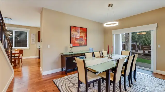 Formal dining room leading to patio for entertaining or relaxing.