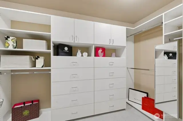 Custom, high-end quality, primary large walk-in closet with many special features.