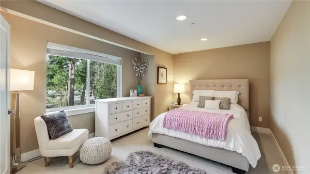 Light & bright bedroom #2 with custom high-end closet, newer carpet & new paint throughout home.