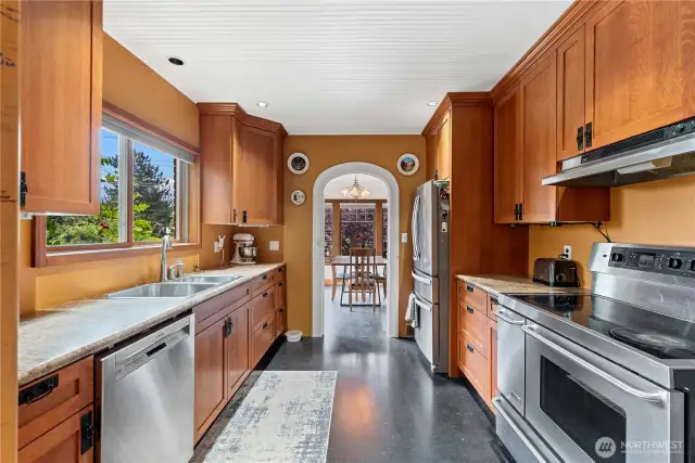 The well appointed kitchen sits off the formal dining room, with plenty of storage and prep space.
