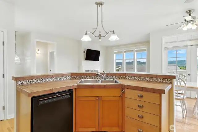 This open-concept kitchen is designed to be the heart of the home, offering both functionality and stunning views