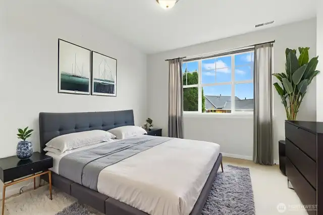One of two spacious bedrooms on the lower level, this room offers comfort and flexibility—perfect for guests, a home office, or a private retreat.