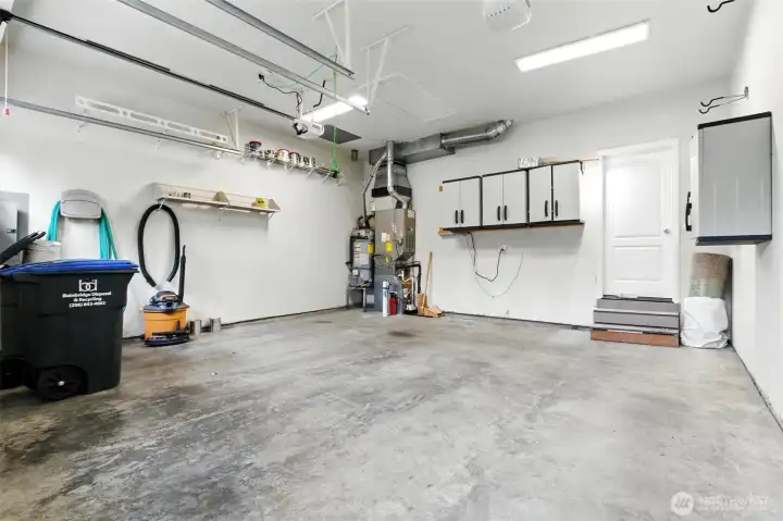 This spacious two-car garage is impressively clean and well-maintained, offering plenty of room for parking,