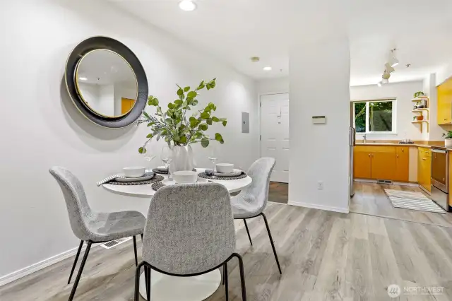 Dining area with new Luxury Vinal Plank flooring.  New paint in this room as well.