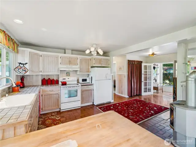 Looking from eating area toward the front door & vestibule.  Bedrooms down the hall.